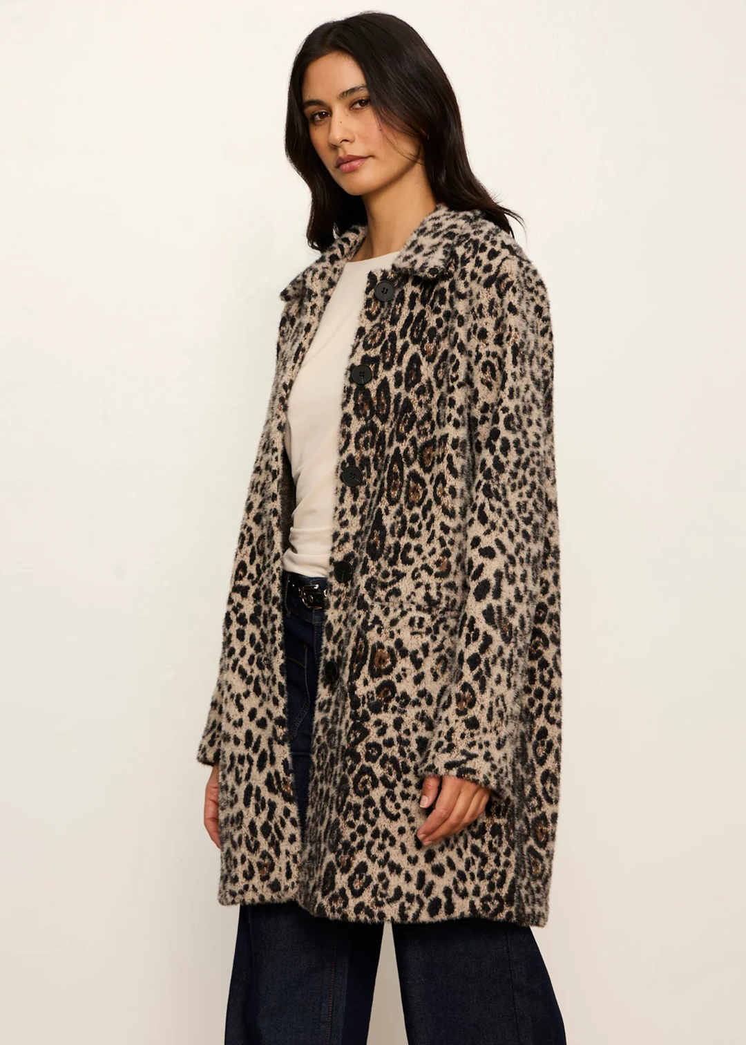 Woman wearing a leopard print coat.
