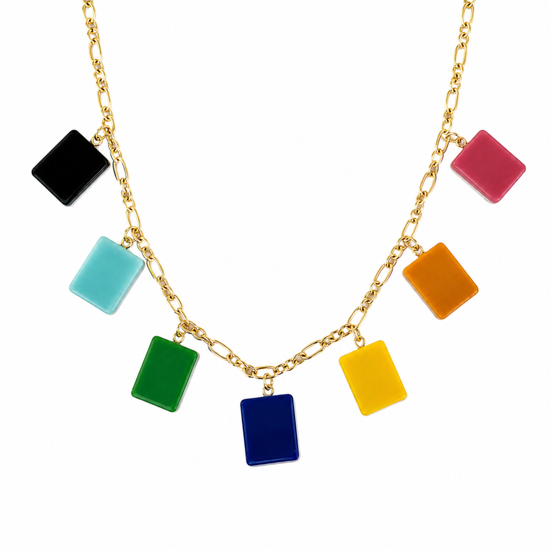 Necklace with colorful square pendants on a gold chain against a white background