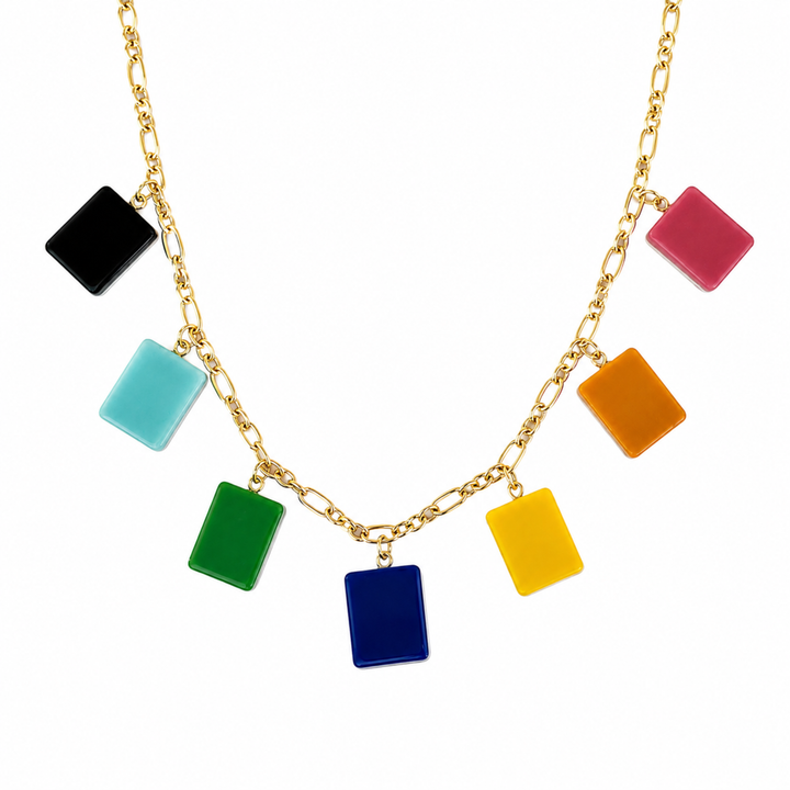 Necklace with colorful square pendants on a gold chain against a white background