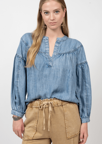 women's denim top with split neckline and puff sleeves with seam details