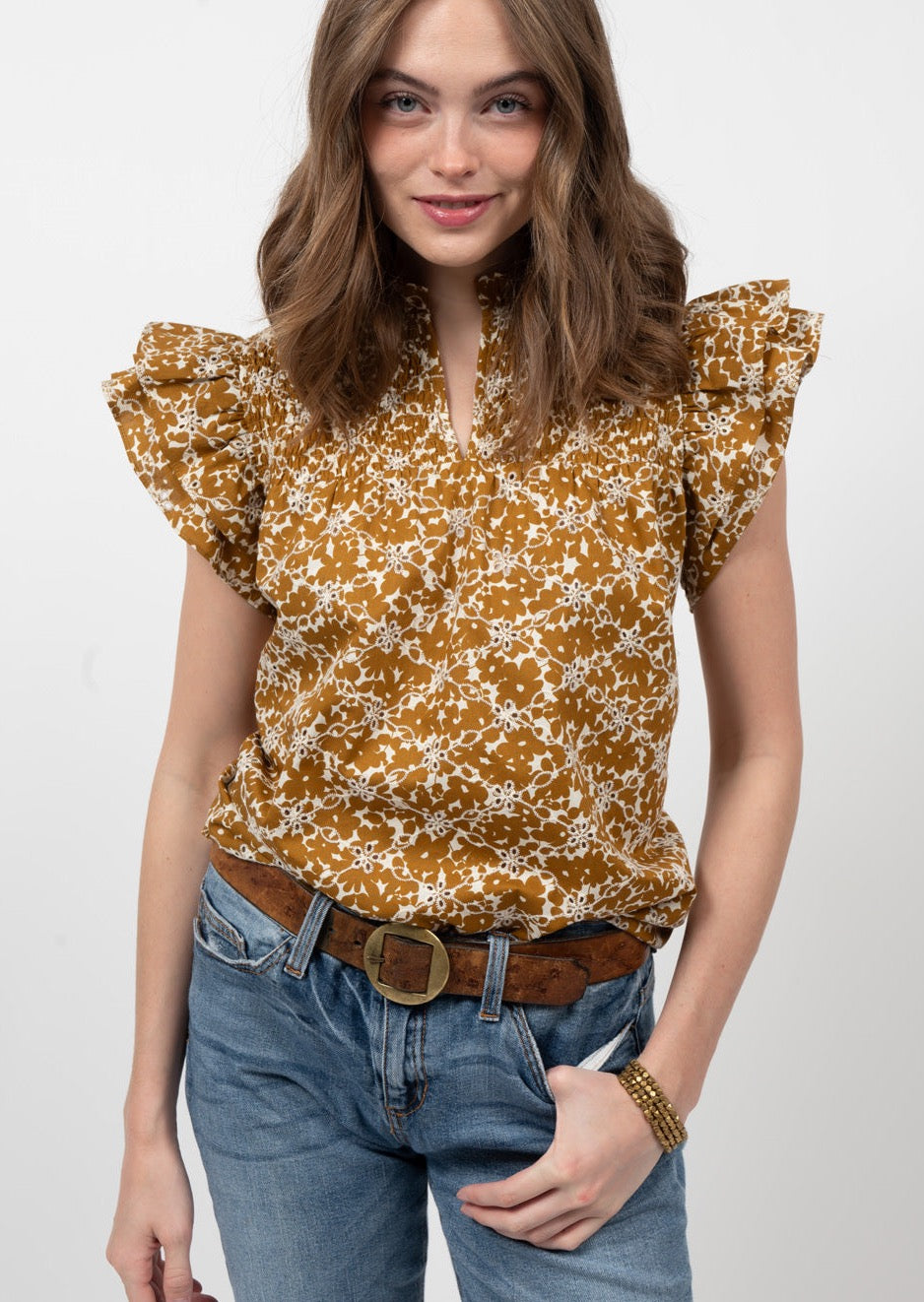 burnt gold flora eyeletl top with split neckline and ruffle sleeves