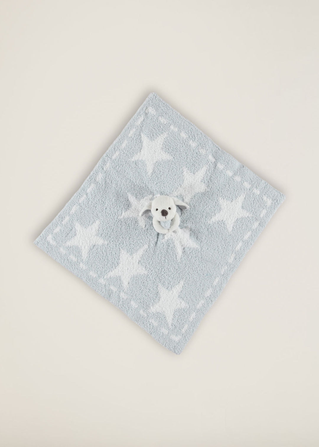 Stuffed bunny with a blue blanket with stars attached