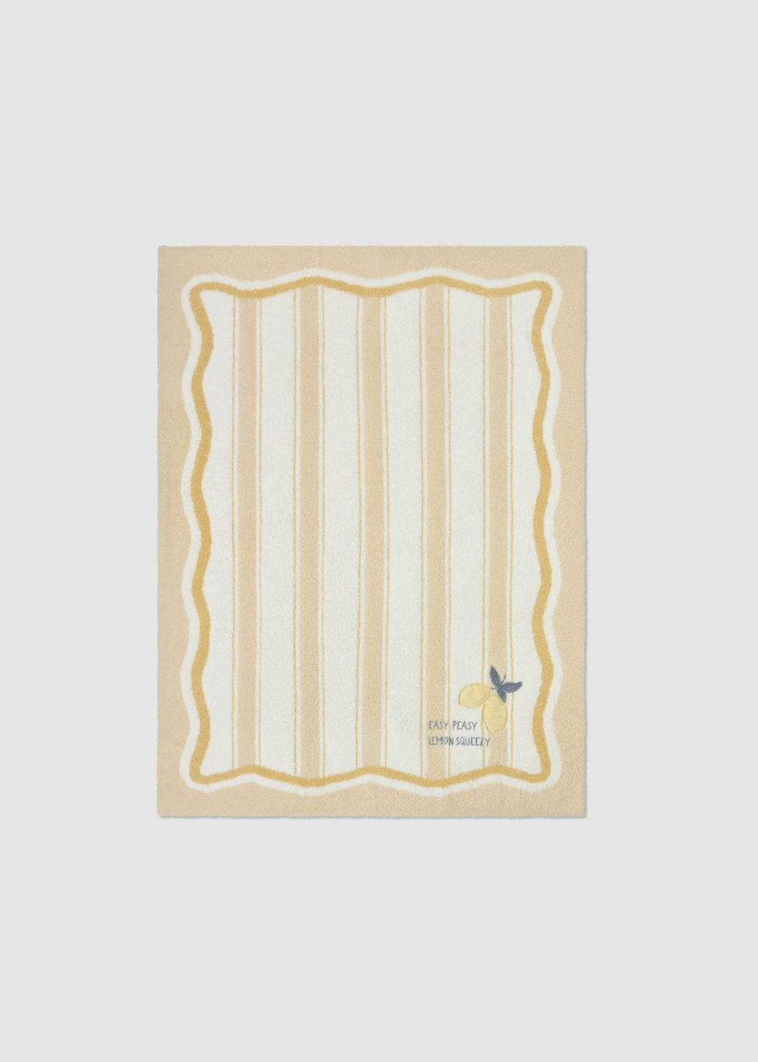 Yellow baby blanket with a striped pattern and lemon embroidery and lettering