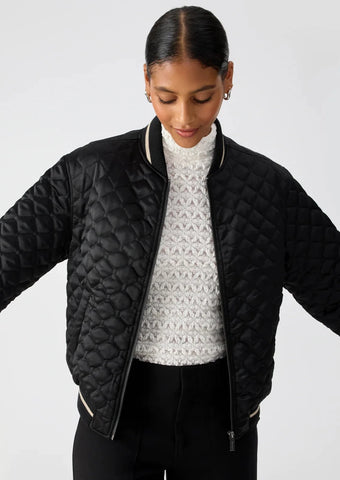 black quilted bomber jacket with black and white stripe details on collar, cuffs, and hemline