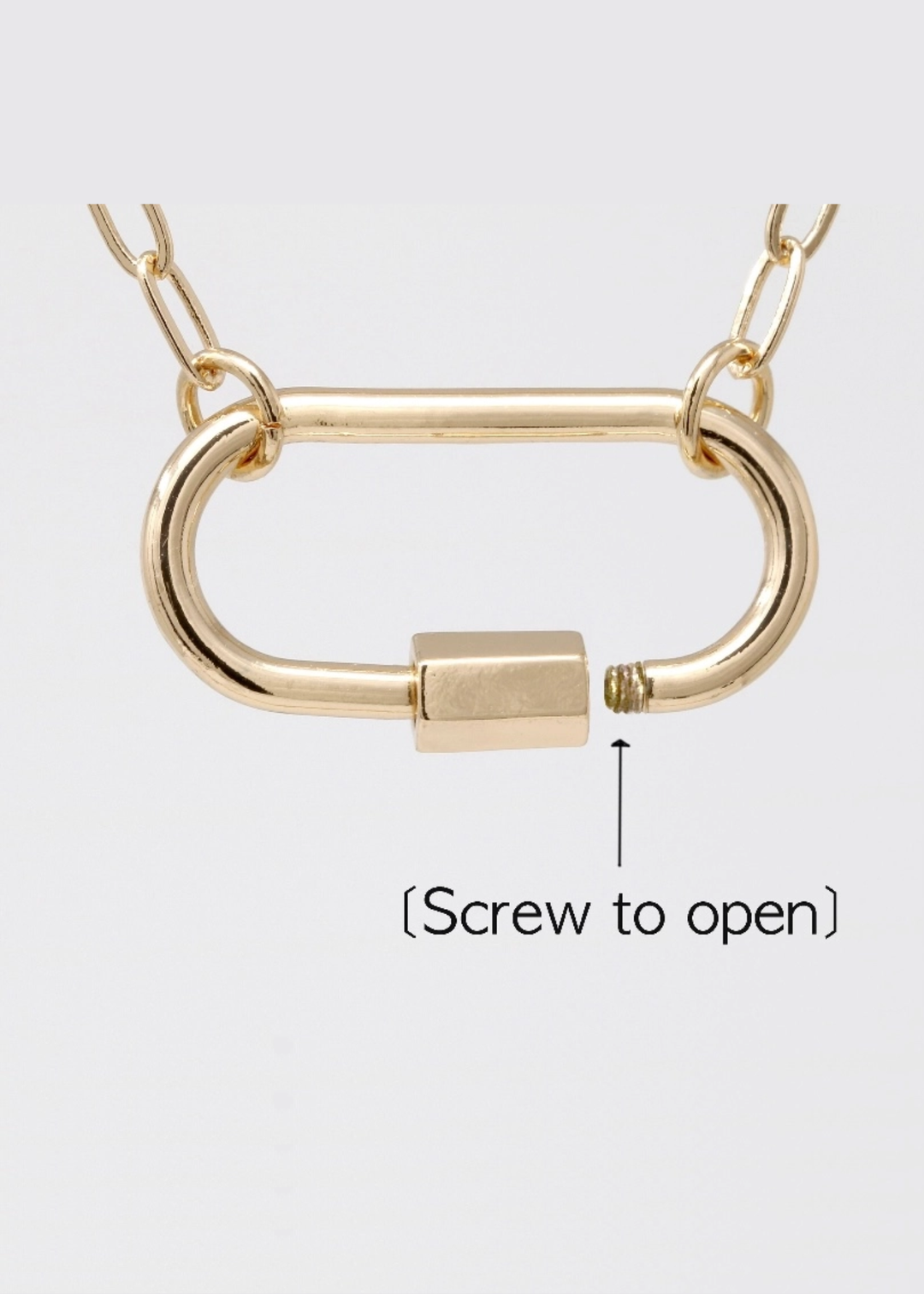 Gold chain necklace with a gold carabiner clasp on a white background