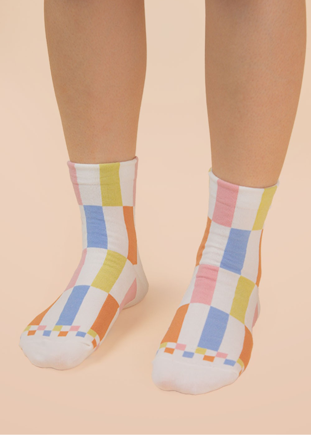 Person wearing multicolor colorblock crew socks
