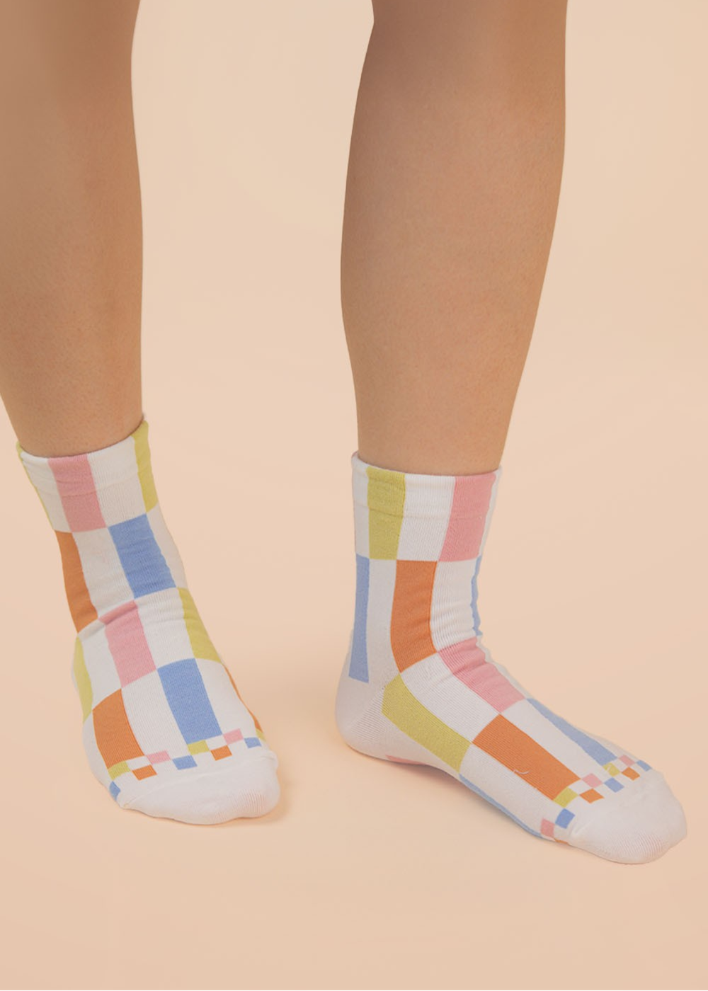 Person wearing multicolor colorblock crew socks
