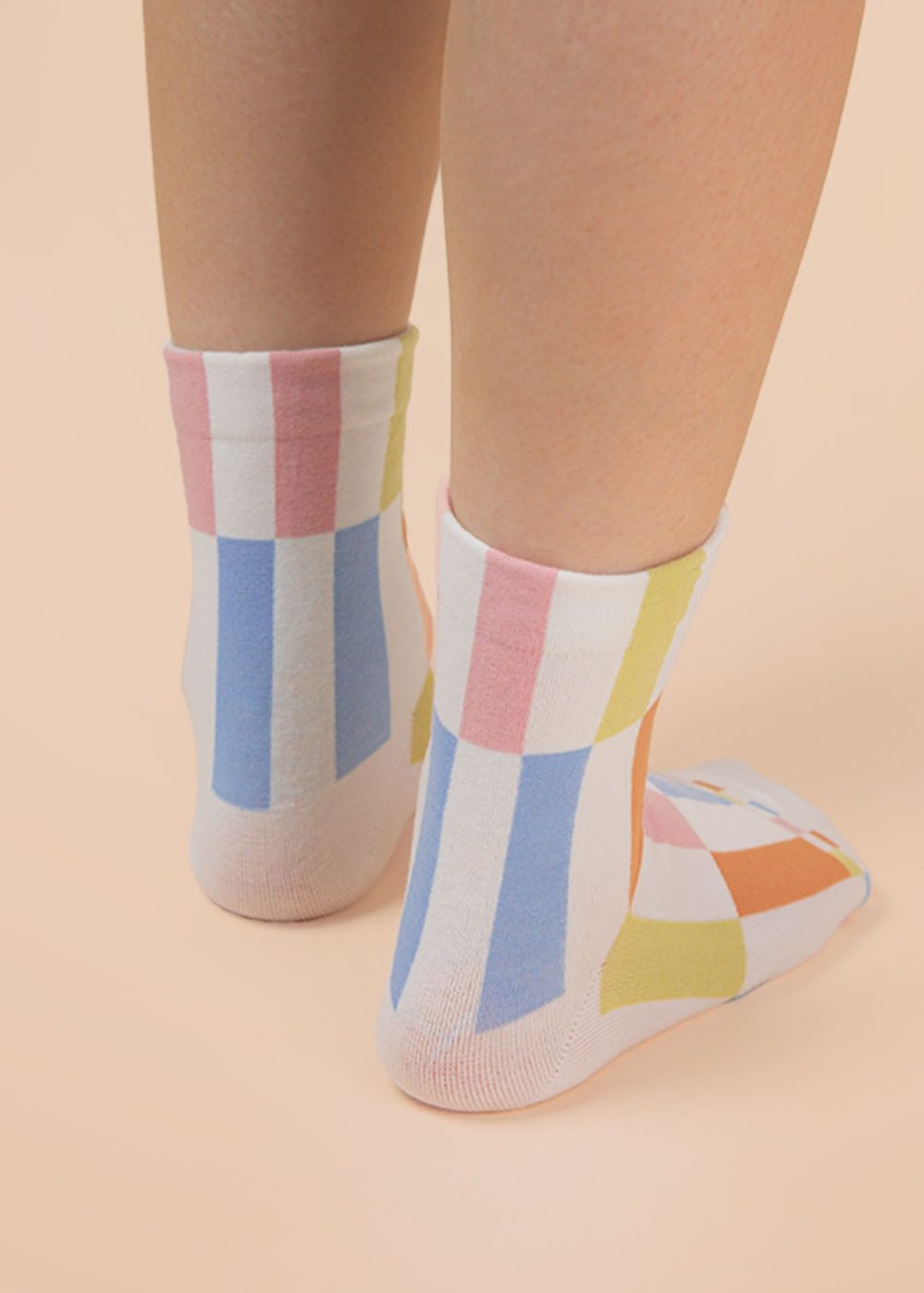 Person wearing multicolor colorblock crew socks