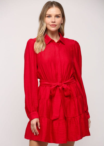 red collared mini dress with long puff sleeves, wait tie belt, and ruffle skirt
