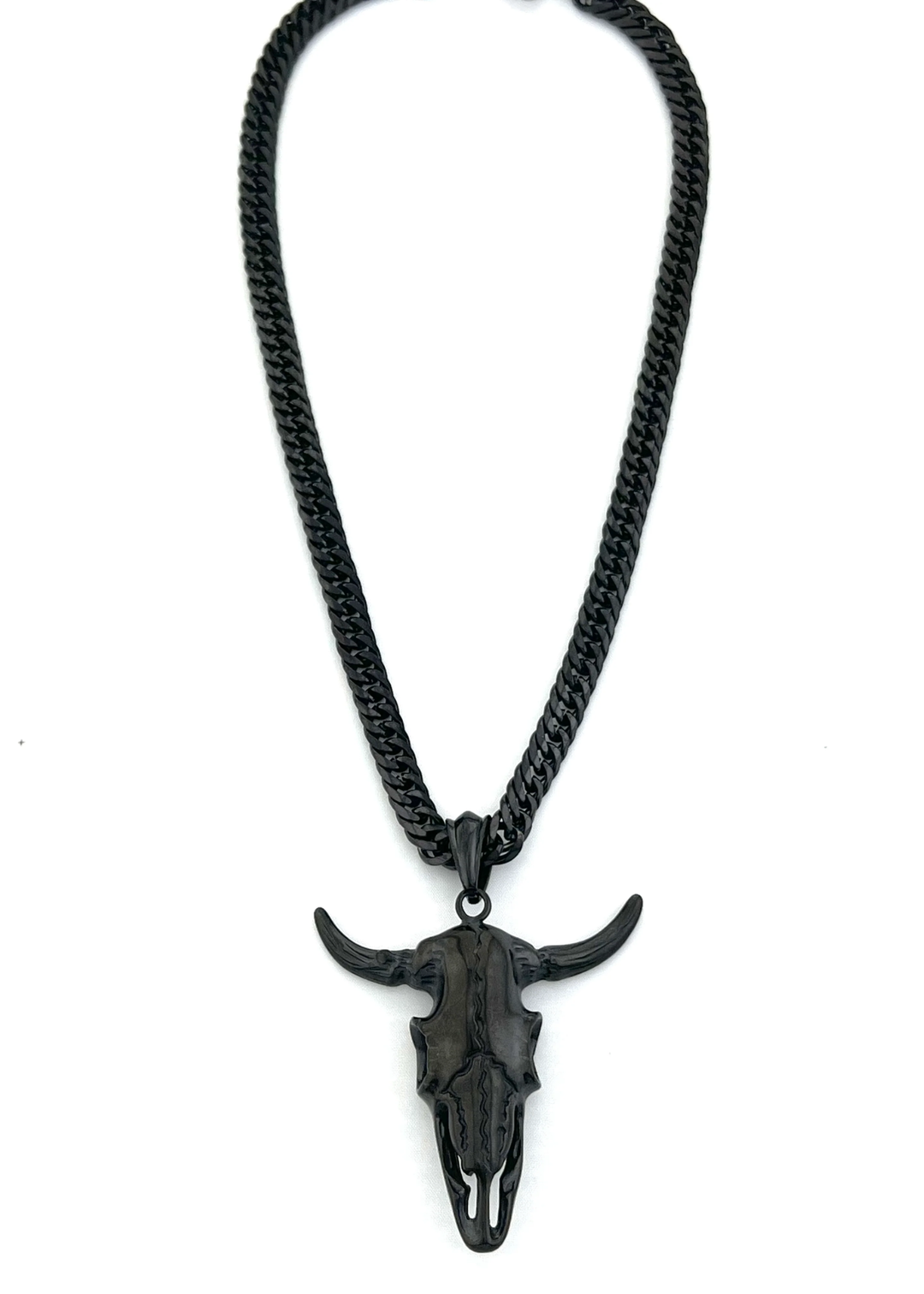 Black chain necklace with a black bull head pendant on a white background