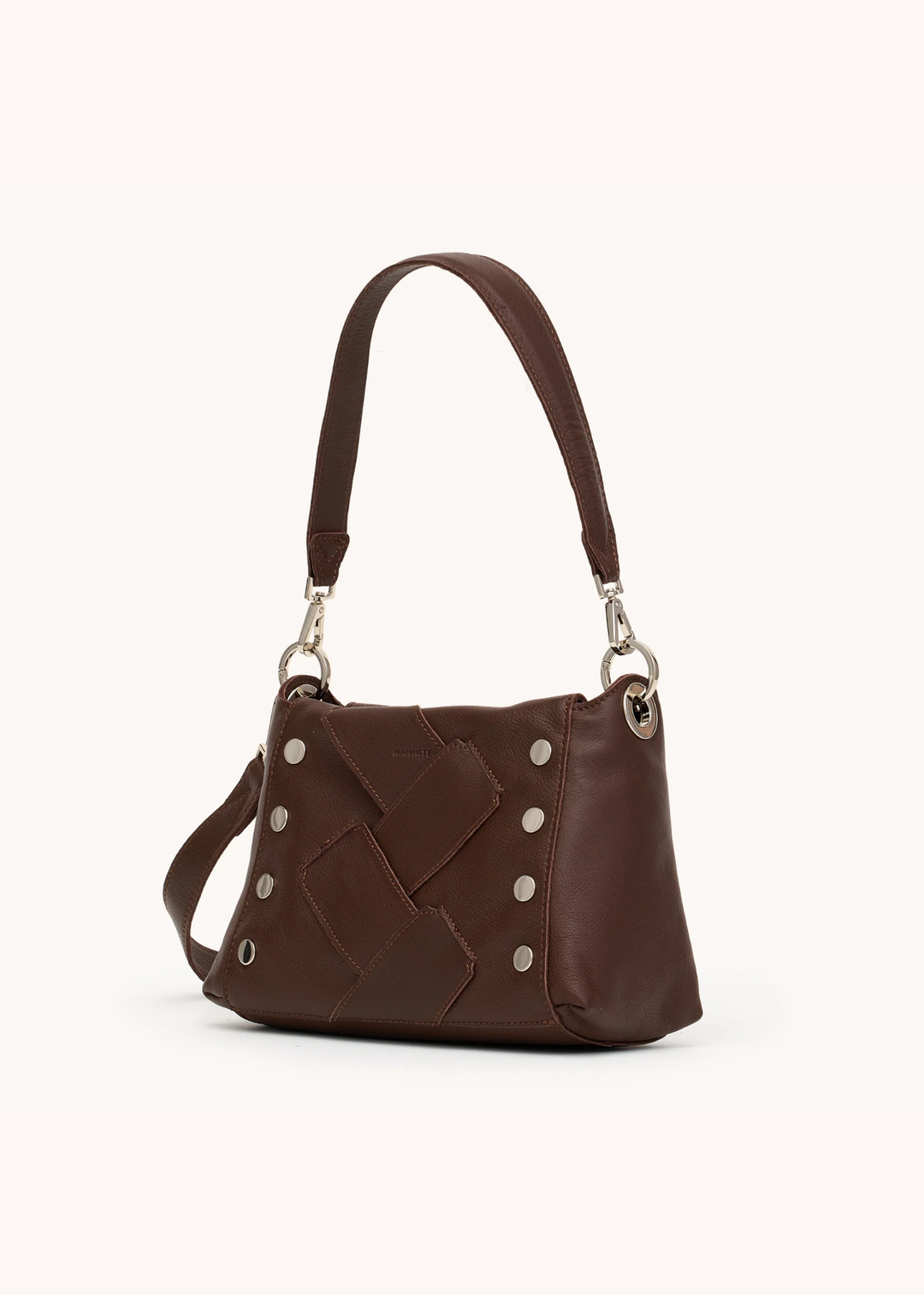 Brown leather woven purse with silver hardware on a white background