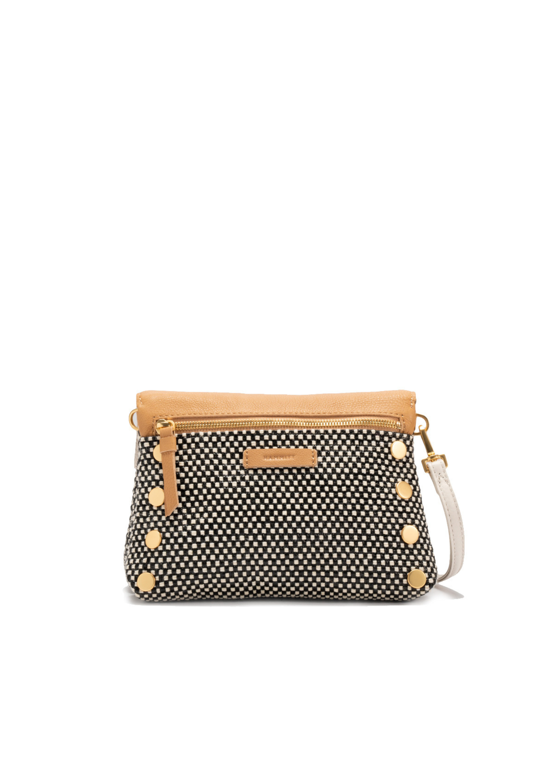 White, tan, and black handbag with gold accents against a white background