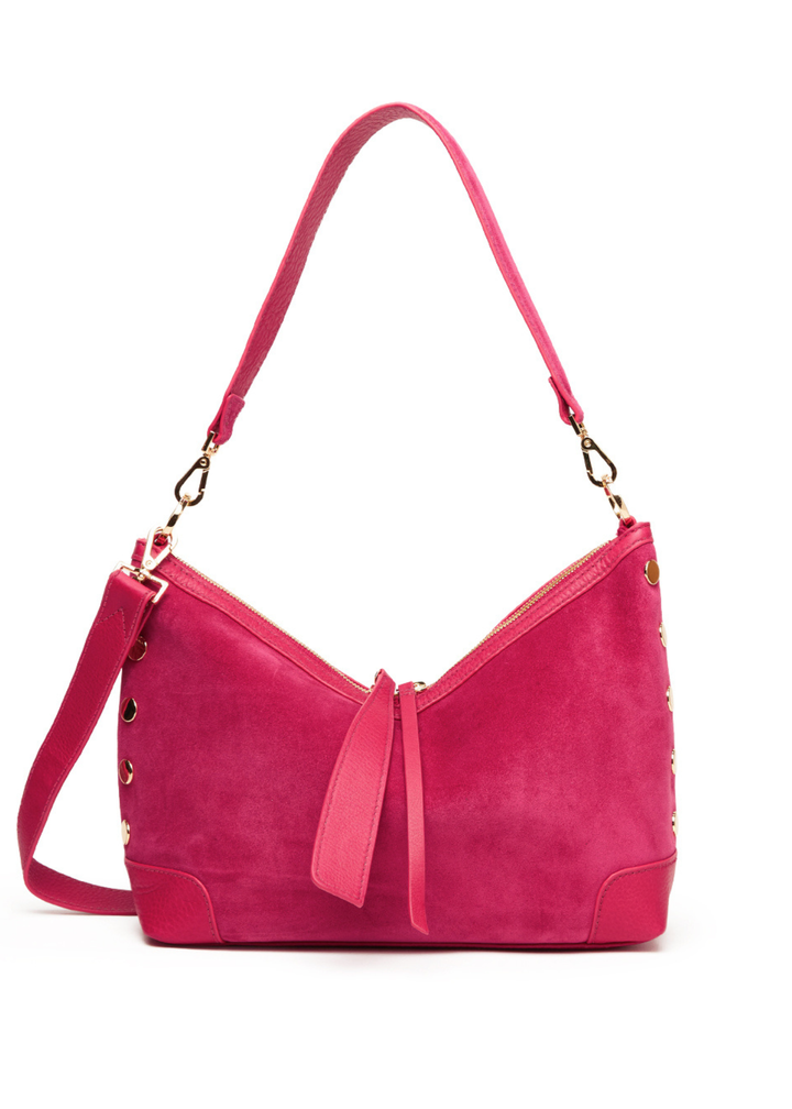 Fuschia suede and leather handbag with gold accents against a white background