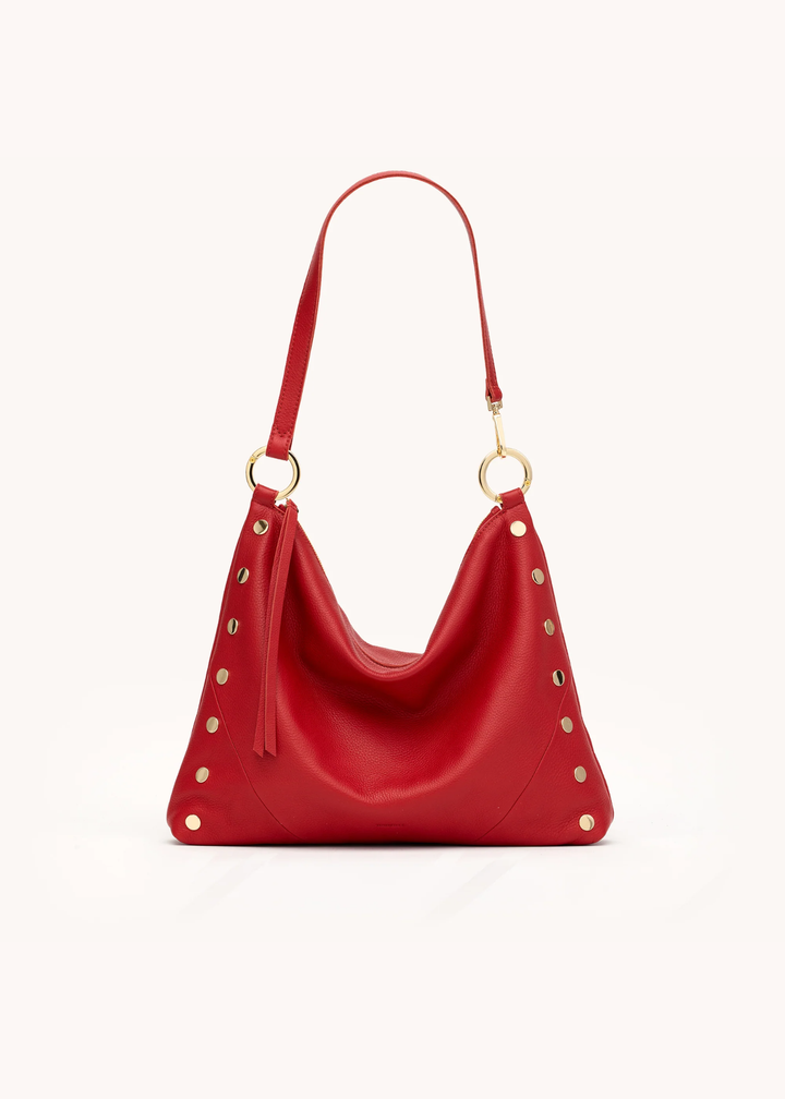 Red leather purse with gold hardware on a white background