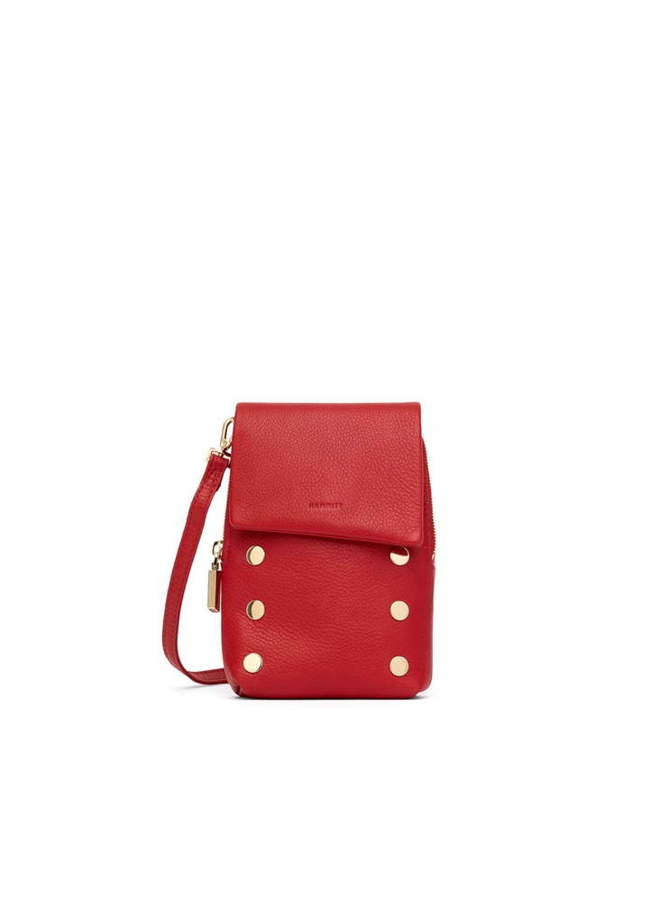 Red leather purse with gold accents on a white background