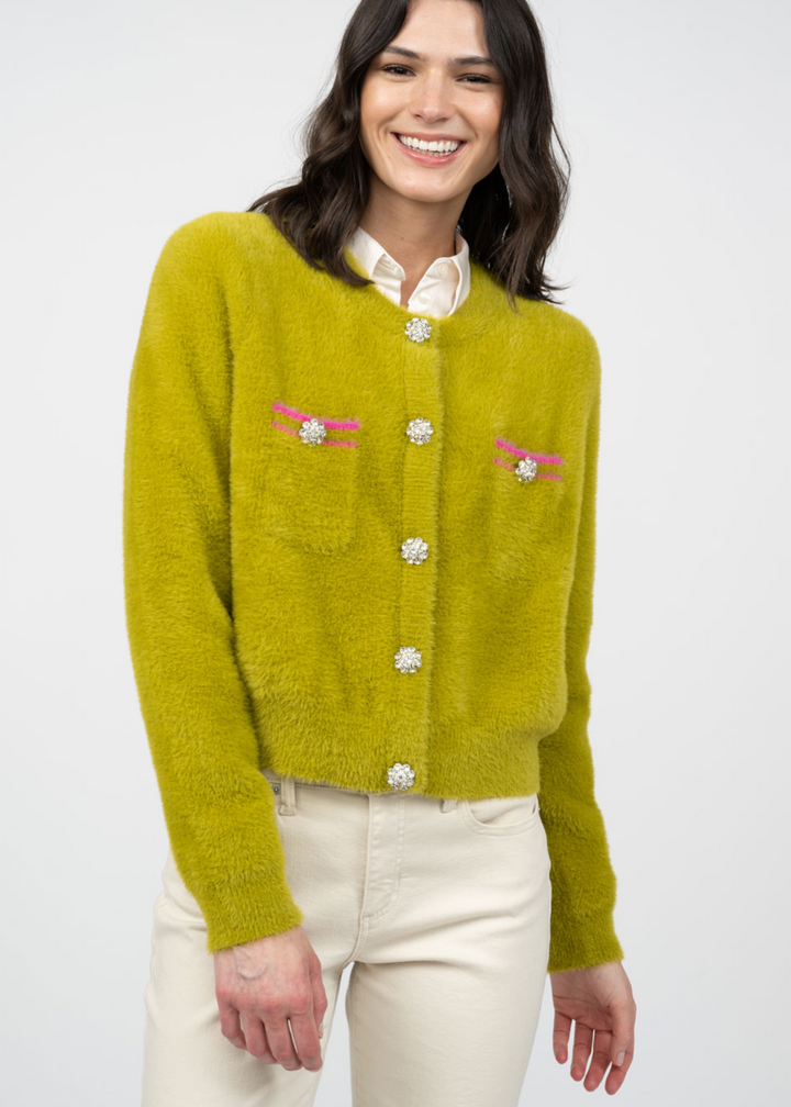 green fuzzy cropped cardigan with pink and orange stripe pocket details with silver rhinestone button