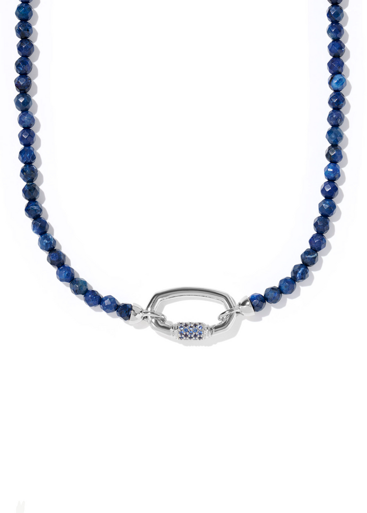 Women's beaded strand necklace with dark blue beads and a silver clasp