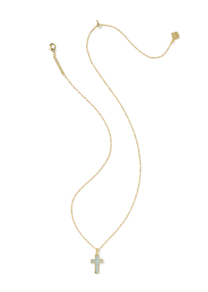 Gold framed cross pendant with a light blue stone on a gold chain necklace