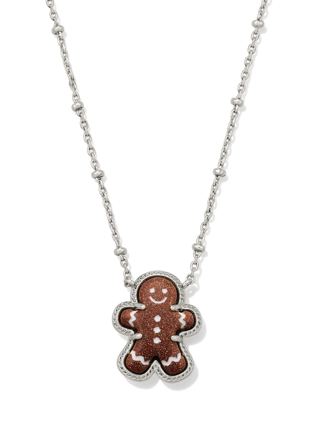Silver necklace with a brown sparkly gingerbread pendant on a white background