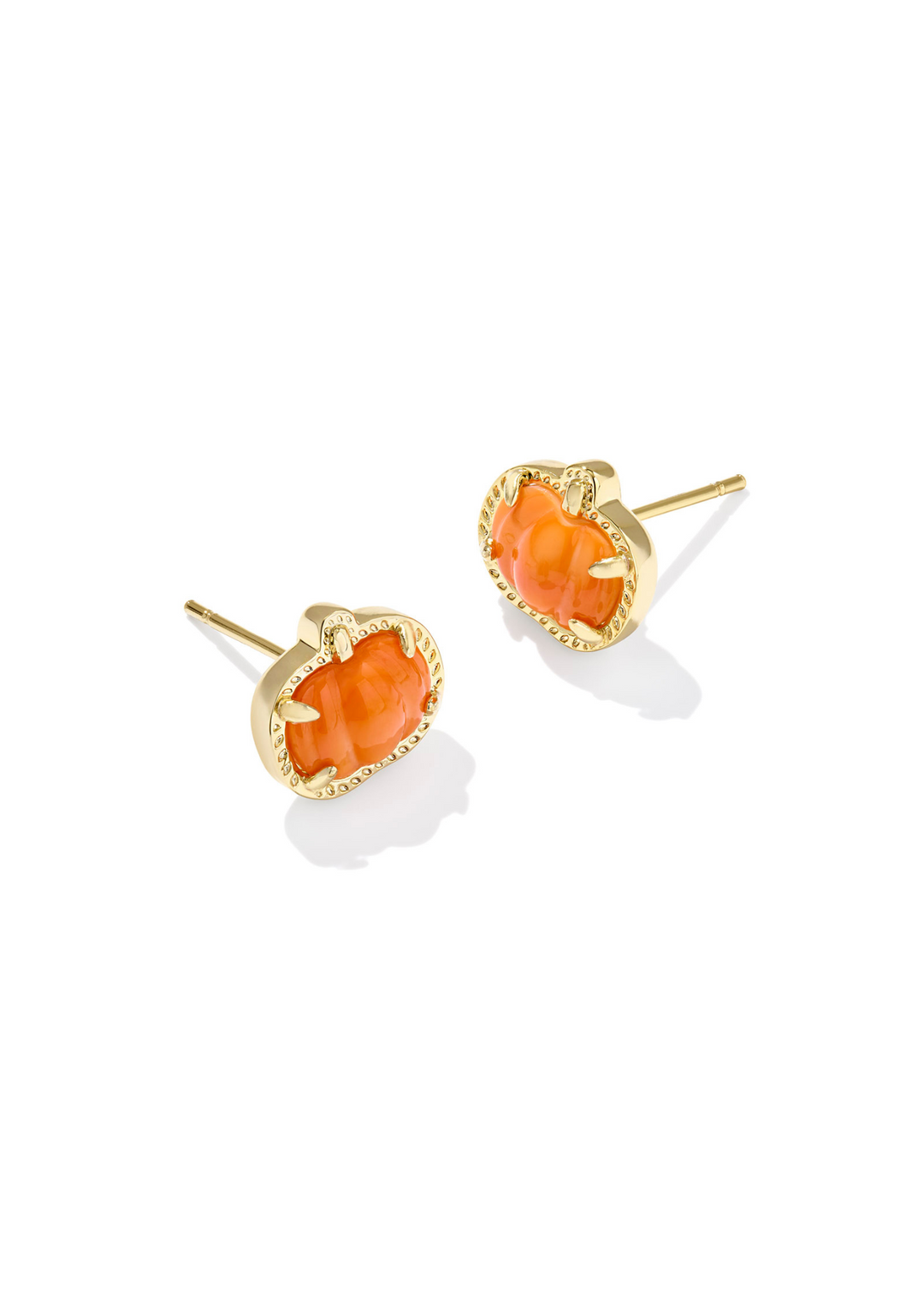 Gold pumpkin shaped stud earrings with an orange stone center on a white background