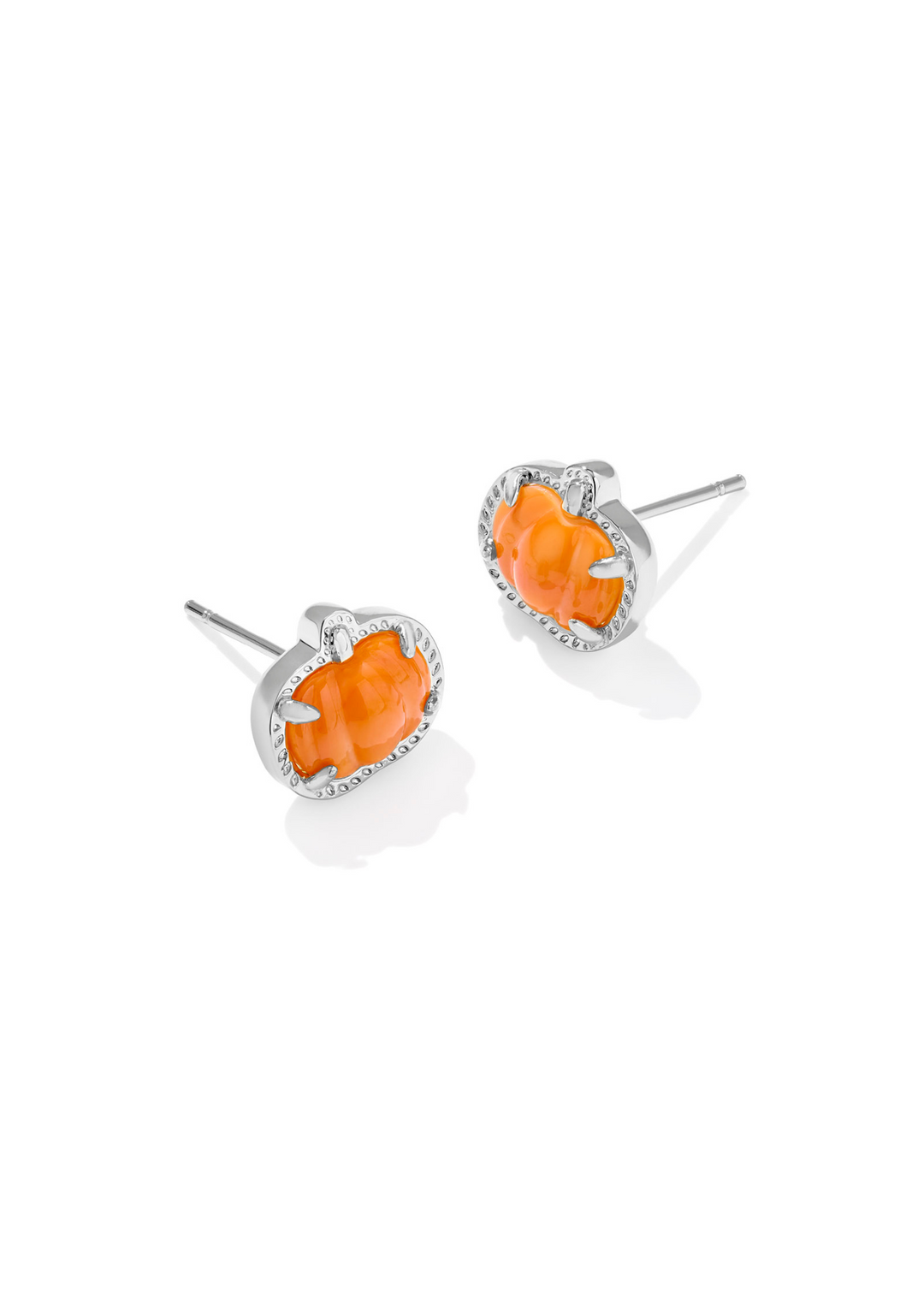Rhodium pumpkin shaped stud earrings with an orange mother of pearl center stone on a white background