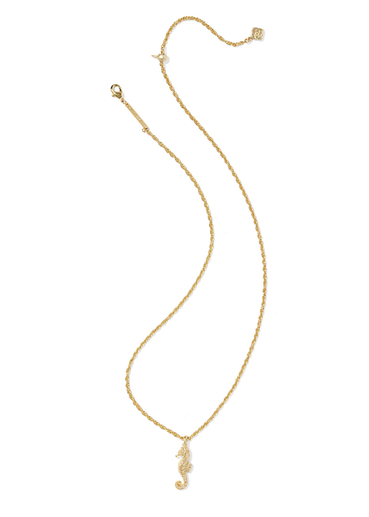 Gold seahorse pendant necklace on a white background