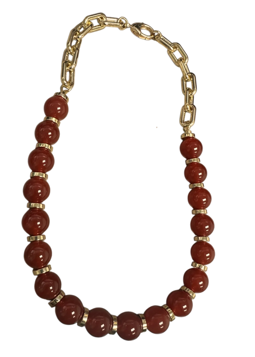 Gold chain and red beaded necklace on a white background