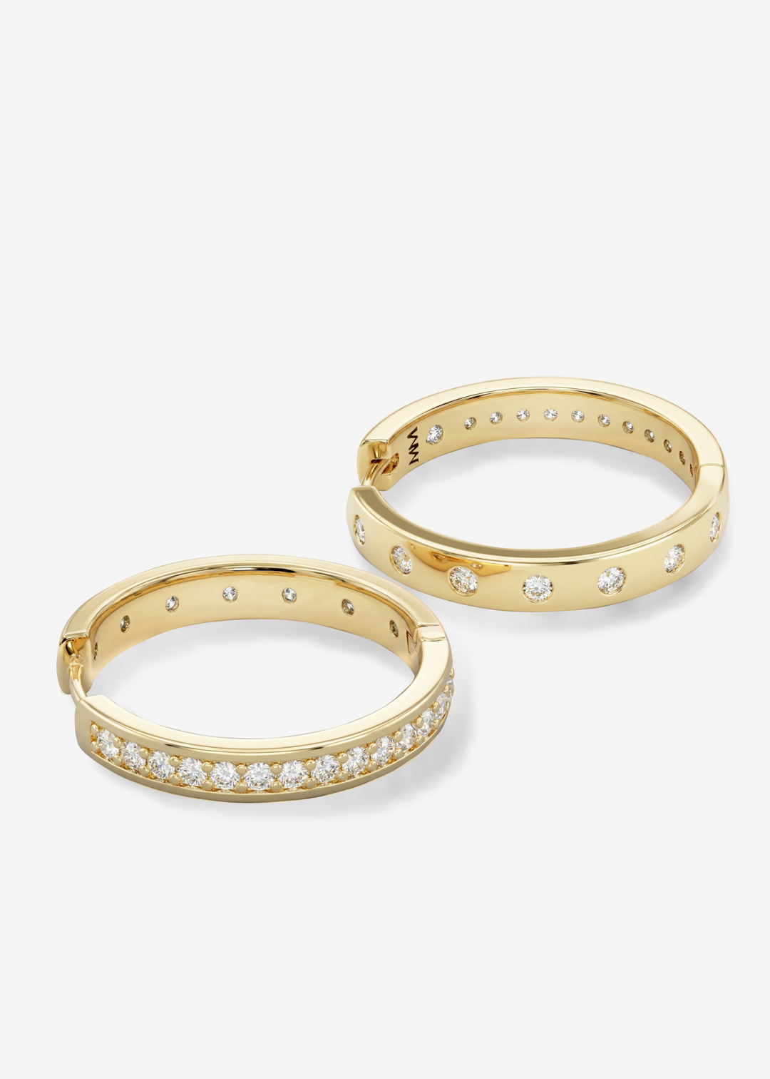 Gold hoop earring with CZ studding against a white background