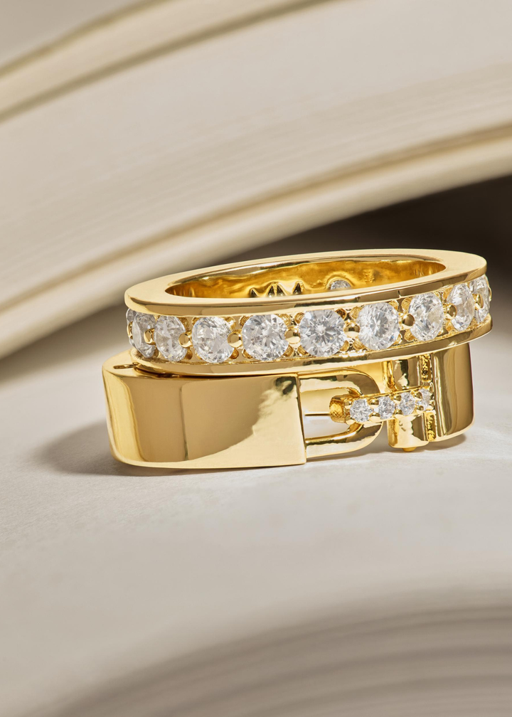 Two gold rings with CZs stacked