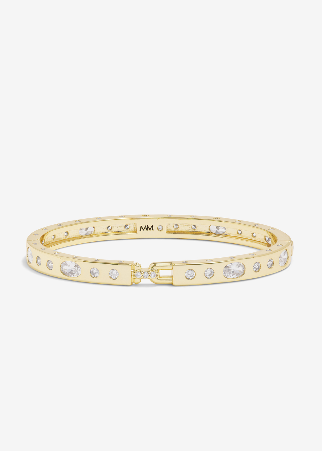 Gold cuff bracelet with CZ studding on a white background
