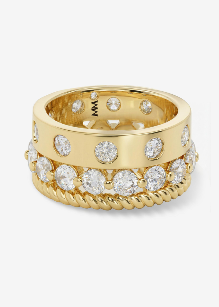 Gold and CZ stacked ring on a white background