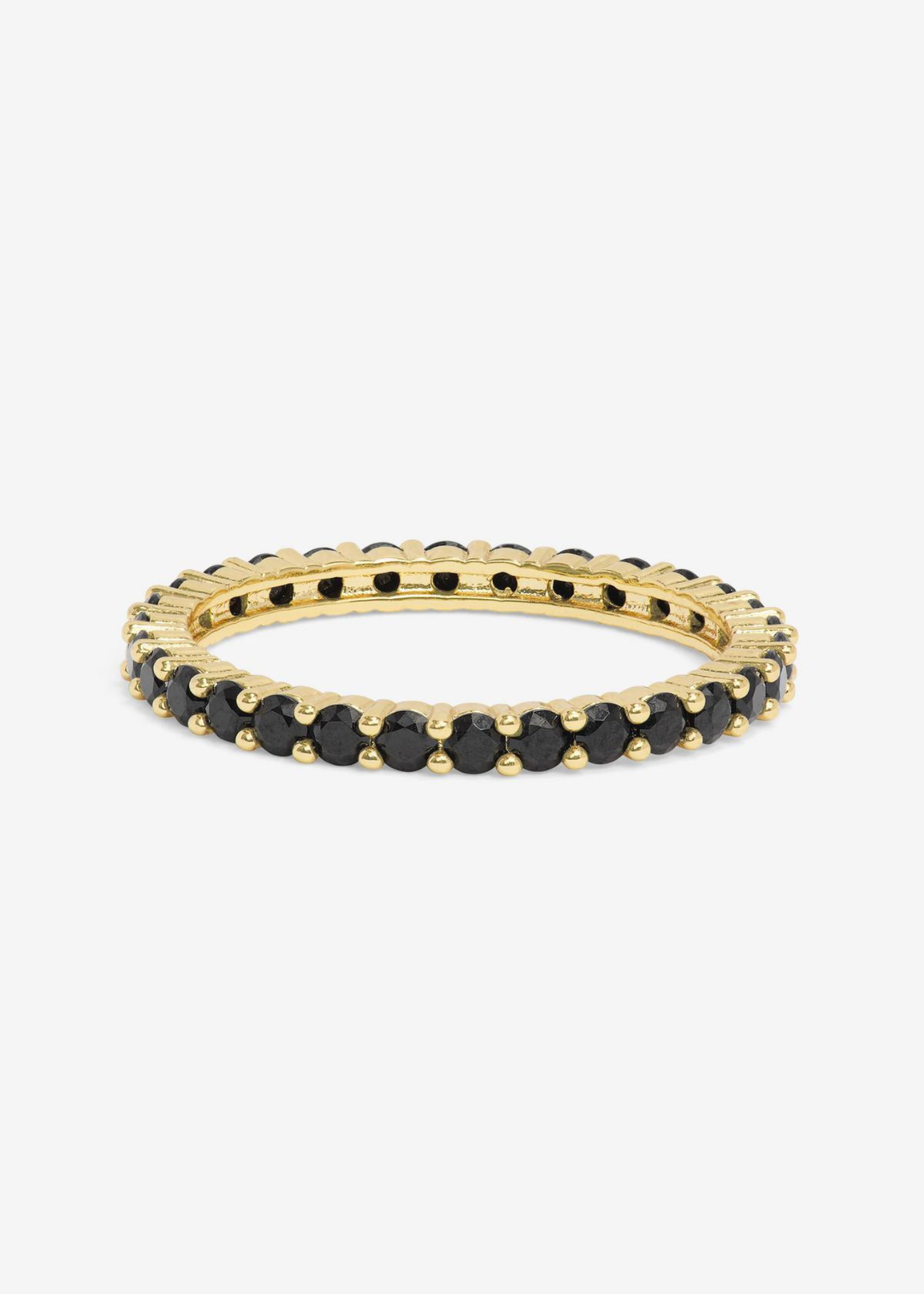 Gold framed ring with black simulated diamonds on a white background