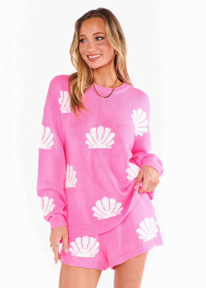 pink knit crew neck with white seashells 