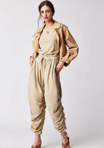 sand sleeveless jumpsuit with drawstring waist and ruched pant legs