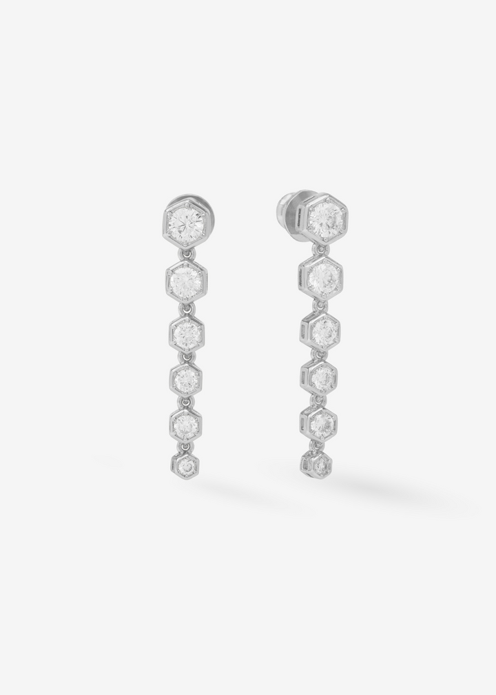Women's diamond drop earrings with silver framing