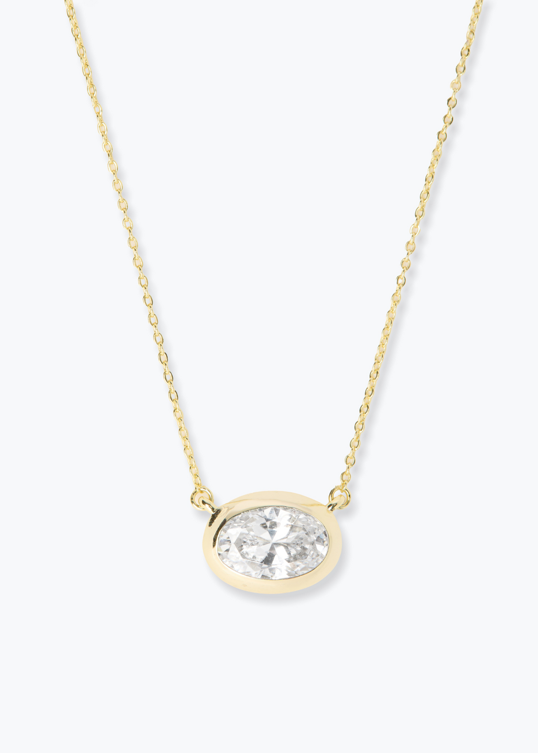 Women's gold pendant necklace with a gold framed diamond pendant