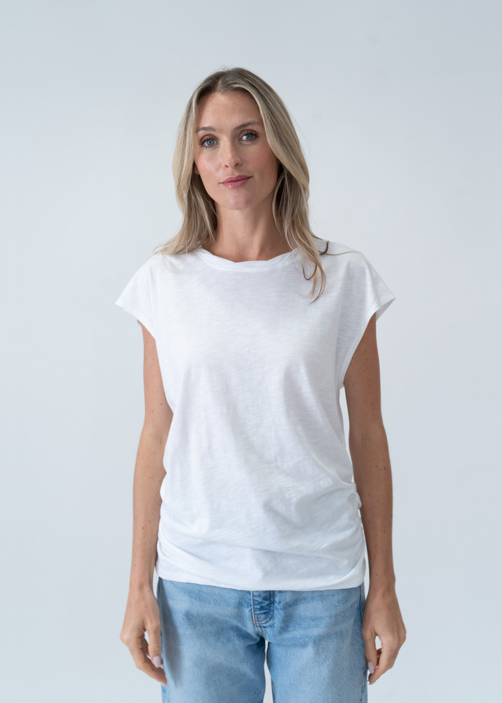 woman wearing white short sleeve tee with ruched body