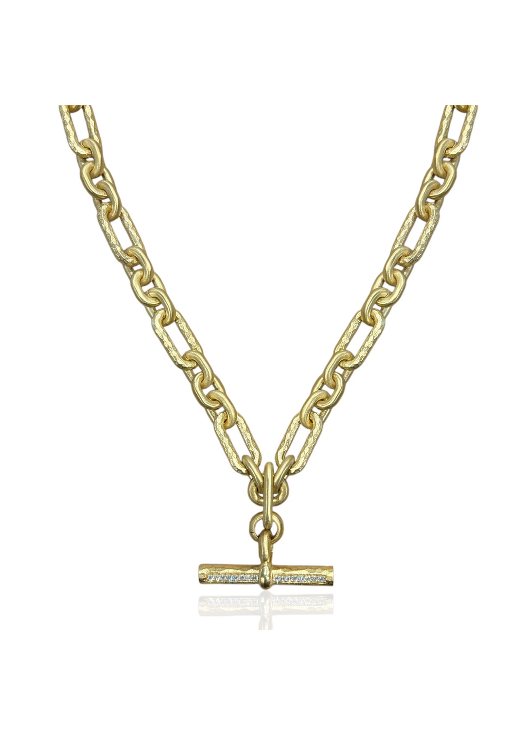 Women's gold chain necklace with a toggle closure and CZ details