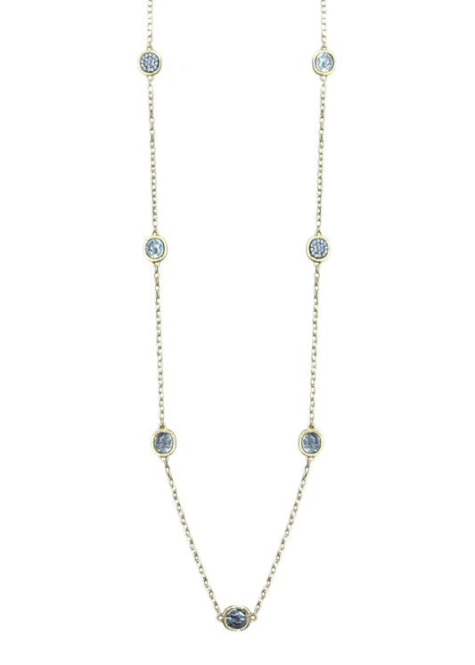 Gold chain necklace with silver coins on a white background