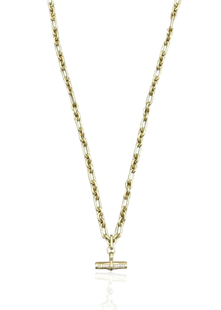 Gold chain necklace with a CZ studded toggle on a white background