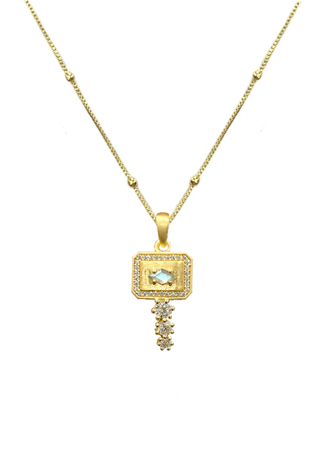 Gold pendant necklace with CZ details on a white background