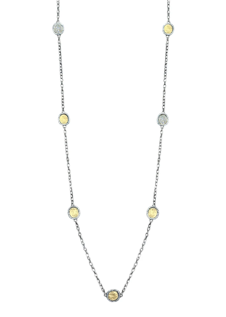 Silver chain necklace with gold coins on a white background