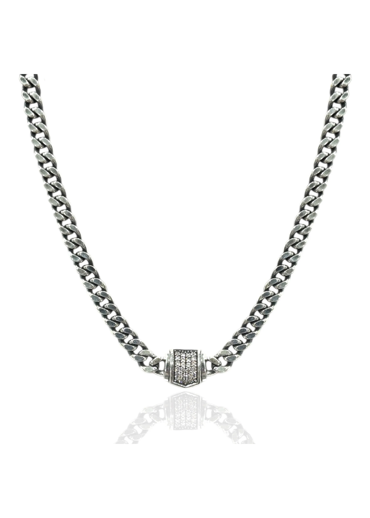 Vintage silver chain necklace with a pave CZ pendant on a white background