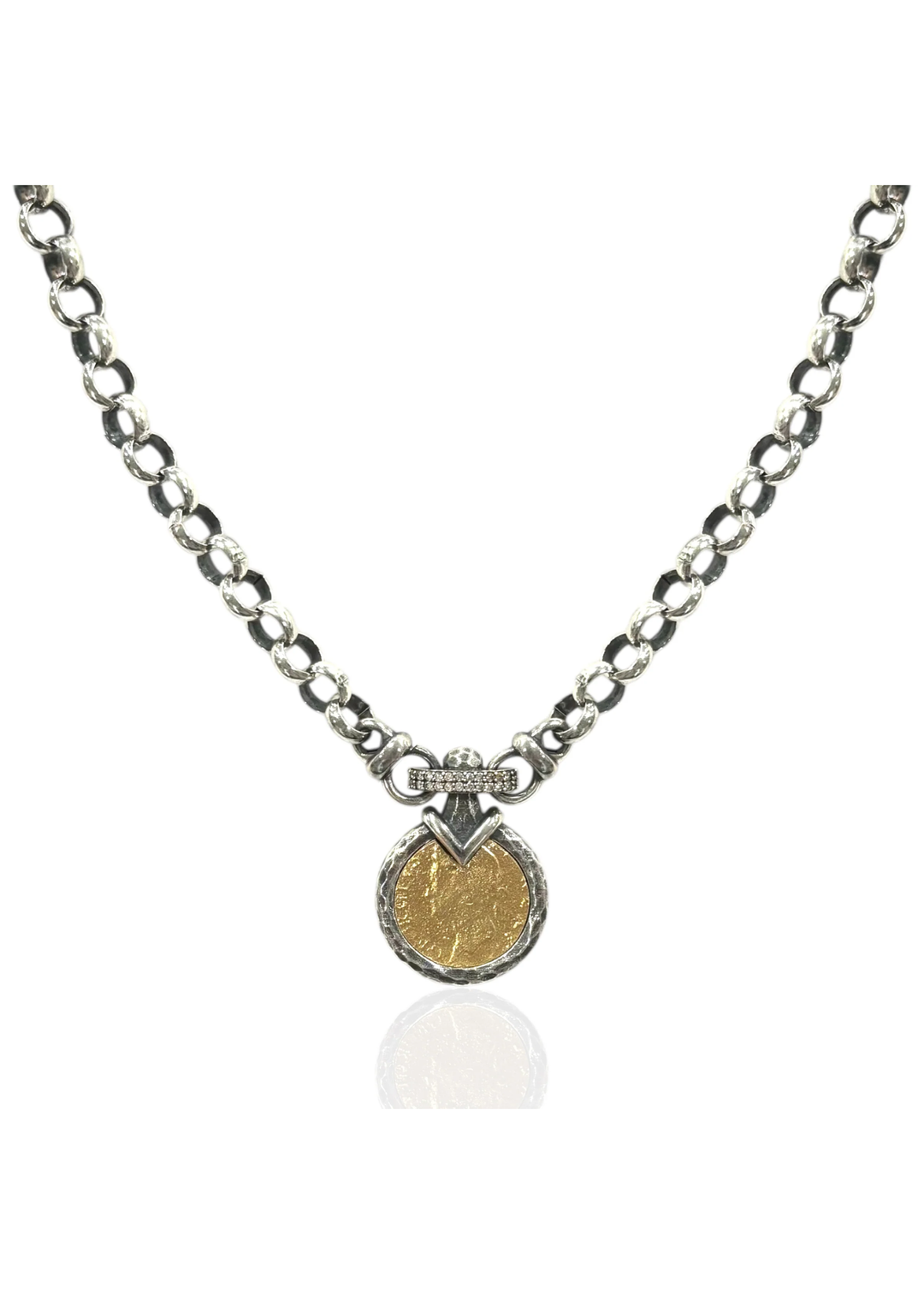A vintage silver chain necklace with a gold coin pendant on a white background