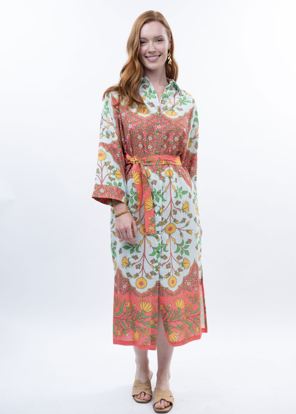 Woman wearing a multicolor floral midi dress with sandals