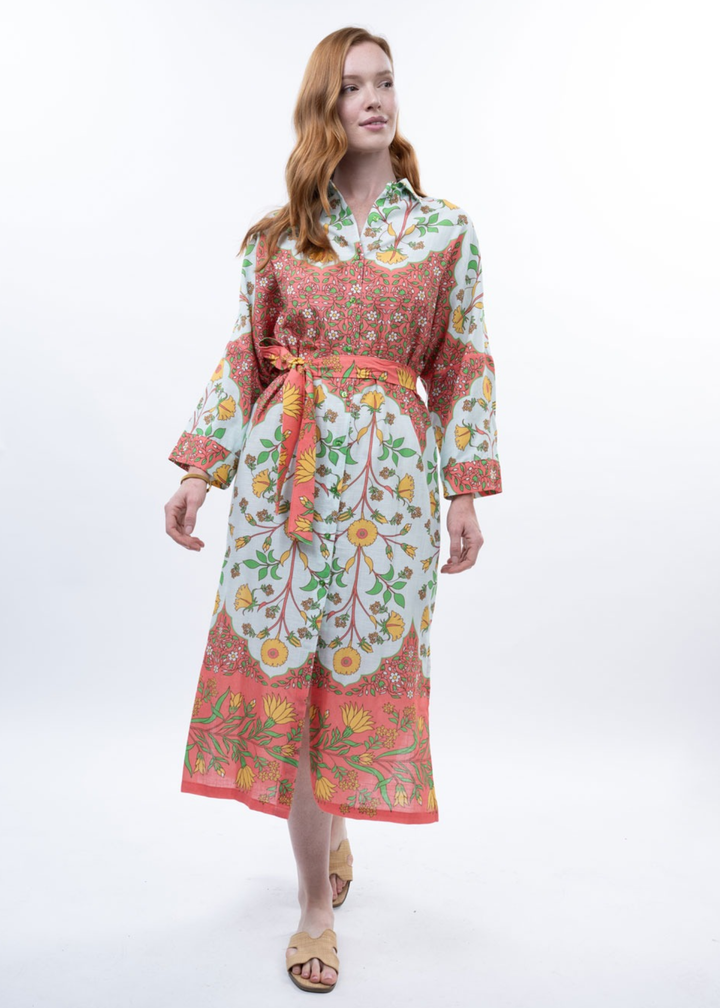 Woman wearing a multicolor floral midi dress with sandals
