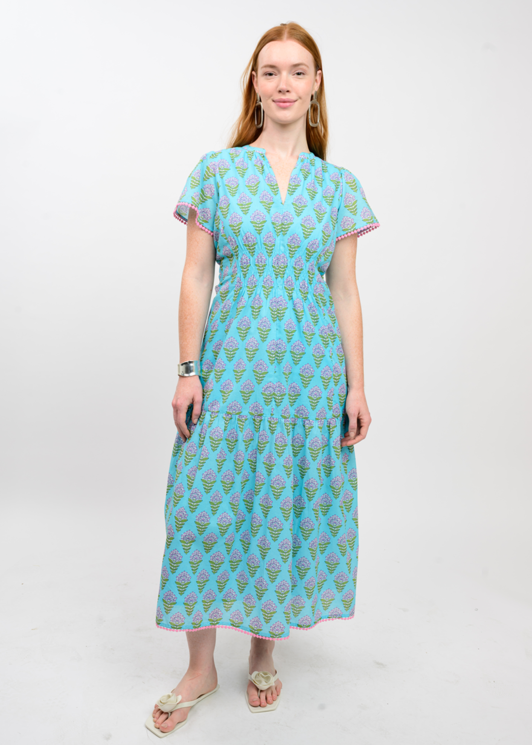 Woman wearing a blue floral print midi dress