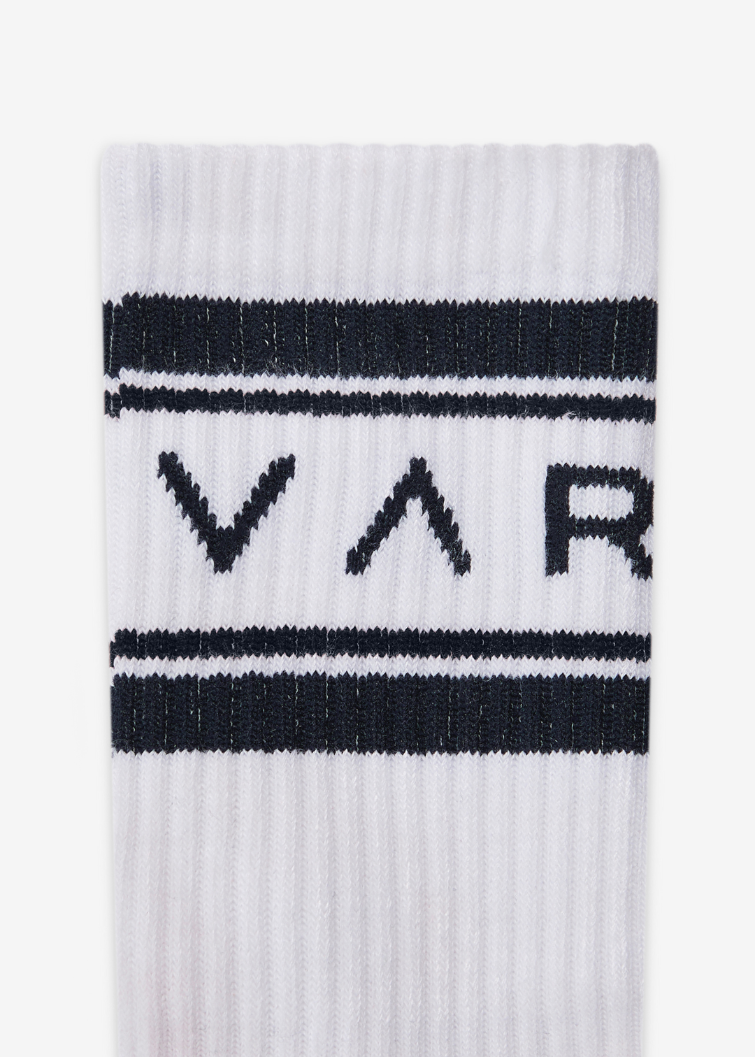 Close up of white crew socks with navy stripes and navy "VAR" lettering against a white background
