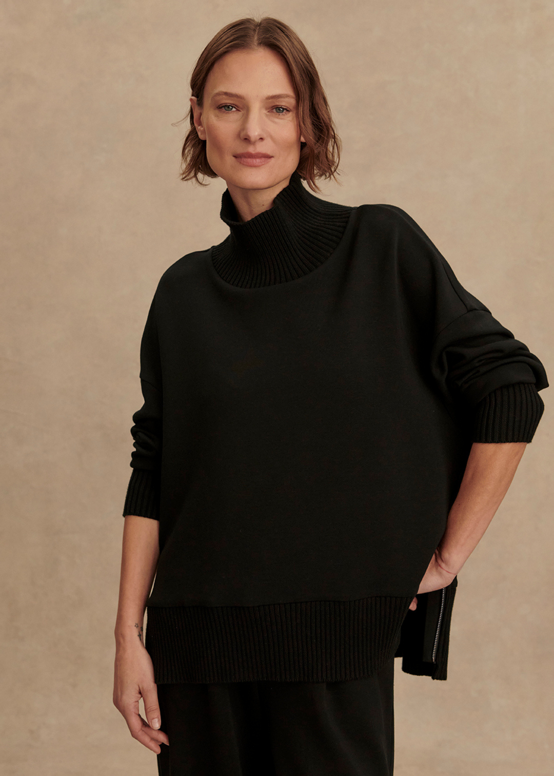 Woman wearing a black sweater top