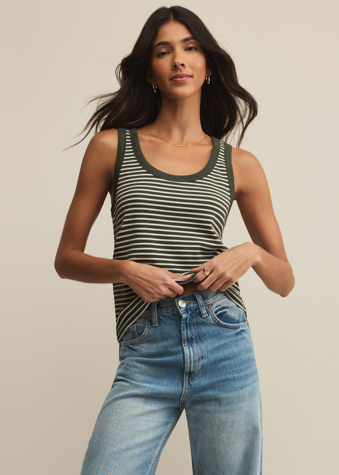 woman wearing dark green and white horizontal stripe scoop neck tank top